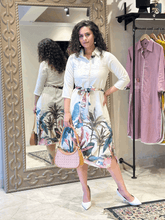 The vibrant floral white midi dress with belt